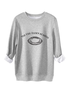 Detail of grey sweatshirt with 'Tis the Damn Season' print and football graphic