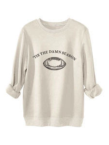 Detail of the soft cream fleece fabric and rugby graphic on the 'Tis The Damn Season sweatshirt