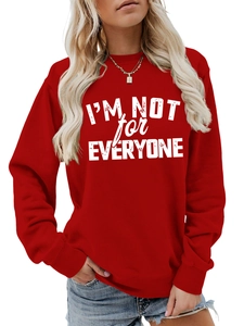 Detail of red crewneck sweatshirt with white I'M NOT for EVERYONE text print on fabric