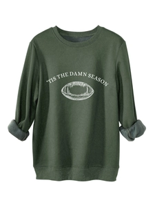 Detail of dark green sweatshirt fleece lining with 'Tis the Damn Season' print