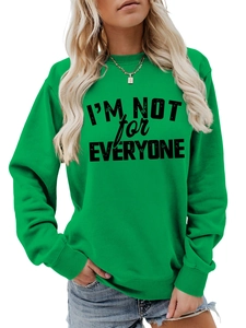 Close-up of bright green sweatshirt featuring black I'M NOT FOR EVERYONE text print