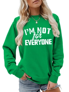 Detail of lime green sweatshirt with white I'M NOT FOR EVERYONE slogan and ribbed cuff