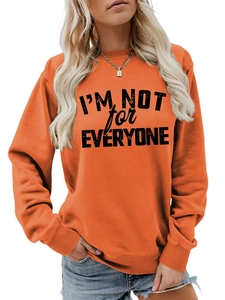 Detail of the vintage distressed I'M NOT FOR EVERYONE print on orange sweatshirt