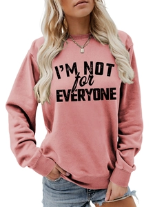 Detail of ribbed cuffs and distressed black letter print on pink sweatshirt fabric