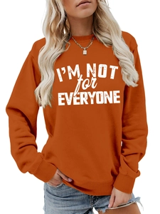 Burnt orange sweatshirt detail showing the white I'M NOT FOR EVERYONE printed slogan