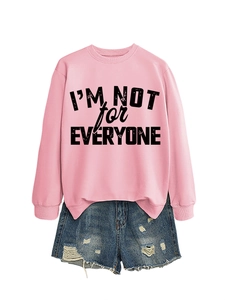 Detail of pink sweatshirt with 'I'M NOT for EVERYONE' text and ripped denim shorts