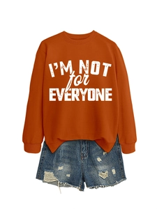 Flat lay of caramel crewneck sweatshirt with I'M NOT FOR EVERYONE print and denim shorts