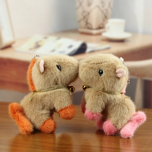 Detail of plush capybara charms with soft fur, golden collars and silver bead chains