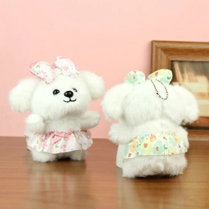 Front and back detail of plush puppy charms with floral dress and silver bead chain