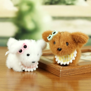 Close-up of cute plush puppies with colorful glasses and checkered bibs as keychains