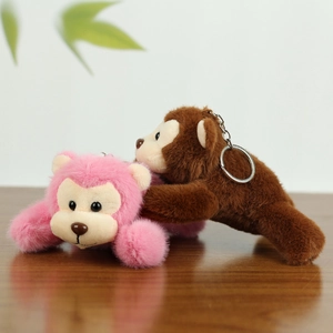 Cute pink and brown plush monkey keychains with soft fur and metal rings for bags
