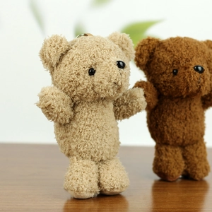 Cute teddy bear plush charms in light beige and dark brown with curly fleece texture