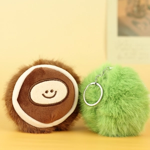 Close-up of cute chestnut plush keychain with soft fur texture and silver metal ring