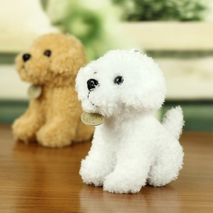 Detail of white and brown teddy dog plush keychains with LOVE metal charms on wood