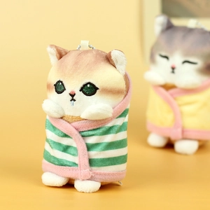 Detail of plush cat keychain wearing striped green bathrobe with pink trim and bead chain