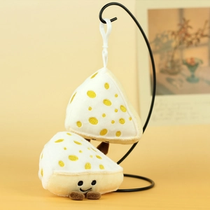 Close-up of cute plush cheese pendant with smiling face embroidery and plastic clip