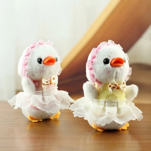 Detailed close-up of cute white plush duck dolls wearing lace dresses and polka dot bows