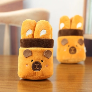 Close-up of cute capybara plush headband and wristband with bear face embroidery