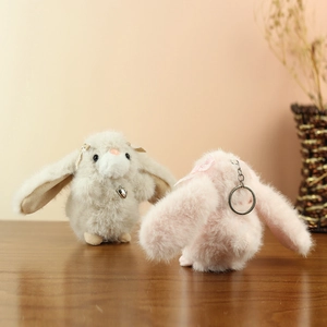 Plush bunny keychain set in beige and pink with heart pendants and soft ribbon bows