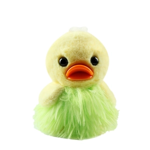 Cute yellow plush duck toy with soft green lace dress and orange beak on white background