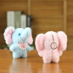 Detailed view of pink and blue plush elephant keychains with soft fur and metal clips