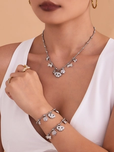 Sparkling puppy jewelry set featuring cubic zirconia necklace and bracelet on model