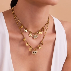 Gold double-layered necklace with puppy paw, heart pendants and sparkling rhinestones