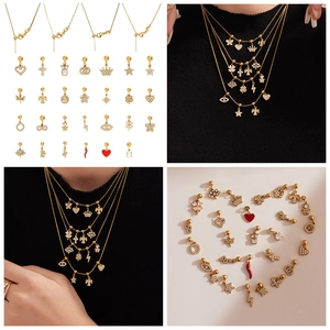 Dettagli dei ciondoli fai-da-te placcati in oro 18k con zirconi e finiture in smalto