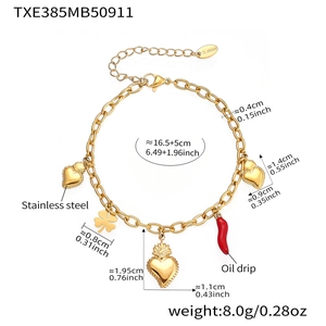 Detail of gold stainless steel bracelet with heart charms and red pepper drop oil pendant
