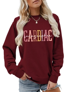 Detail of the CARDIAC sonographer print on a maroon crewneck sweatshirt for women