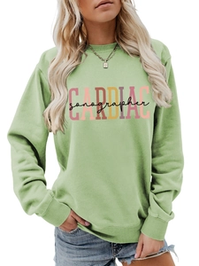 Detail of ribbed neckline and colorful CARDIAC sonographer print on a green sweatshirt