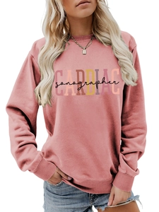Detail of ribbed cuffs and Cardiac Sonographer print on pink crewneck sweatshirt