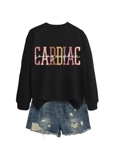 Detail of Cardiac Sonographer print on black sweatshirt with frayed denim shorts