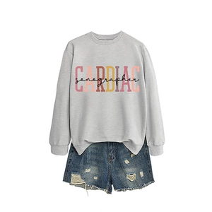Women's grey CARDIAC sonographer sweatshirt paired with distressed denim shorts