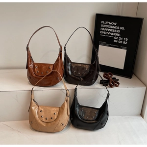 Detailed grid view of crescent shoulder bags in four colors with stylish metal rivet decor