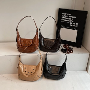 Retro studded crescent hobo bag in caramel, chocolate, beige and black leather finishes