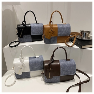 Detail of color-block tote bags in four styles with denim patchwork and top handles