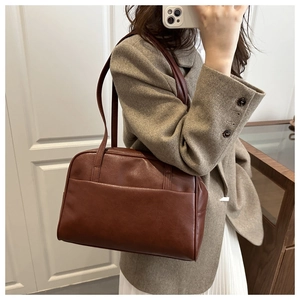 Vintage brown leather Boston shoulder bag styled with an elegant autumn blazer and skirt