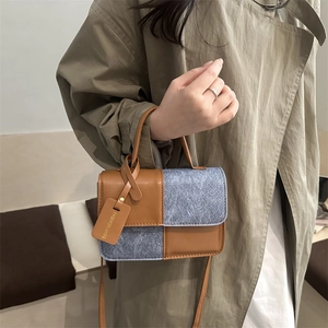 Chic color-block handbag with brown leather and grey wool texture panels in square design