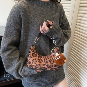 Vintage leopard print hobo bag with gold chain strap and plush charm for women