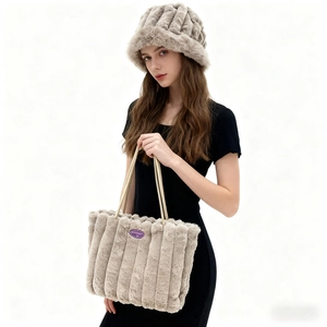 Detail of plush fuzzy tote bag and matching bucket hat set with vertical stripe texture