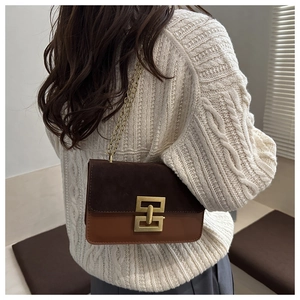Chic dark brown and caramel patchwork suede shoulder bag with vintage gold hardware