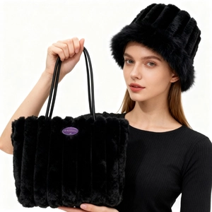 Detail of black faux fur tote bag and matching bucket hat with striped texture