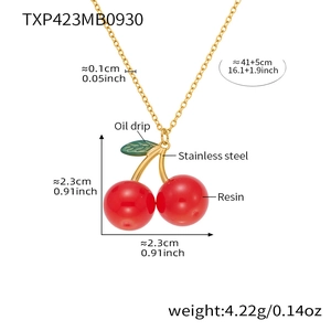 Detail view of red resin cherry necklace with golden stainless steel chain and leaf dimensions