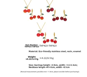 Detailed view of cherry jewelry set including resin necklace and stainless steel earrings