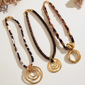 Bohemian gold geometric pendant necklaces with leopard print silk ropes and pearl details