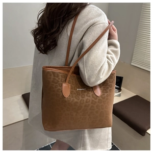 Detail of soft leopard print texture on a large capacity tote bag for women