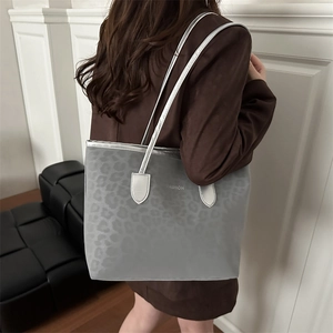 Fashionable leopard print tote bag with silver straps and FASHION lettering