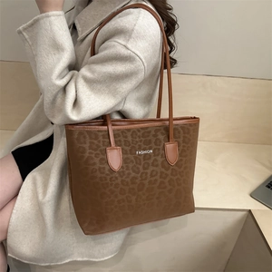 Retro leopard print tote bag with brown leather straps and fashion text for autumn winter