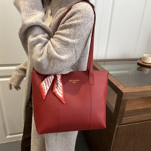 Red large-capacity leather tote bag with stylish scarf handle and gold lettering